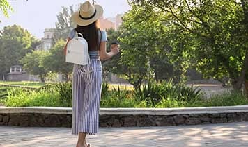 woman in park with coffee