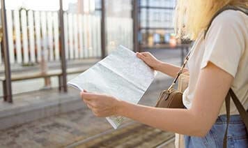 woman reading map