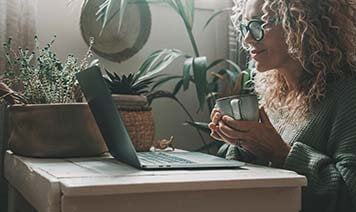 woman with laptop and coffee