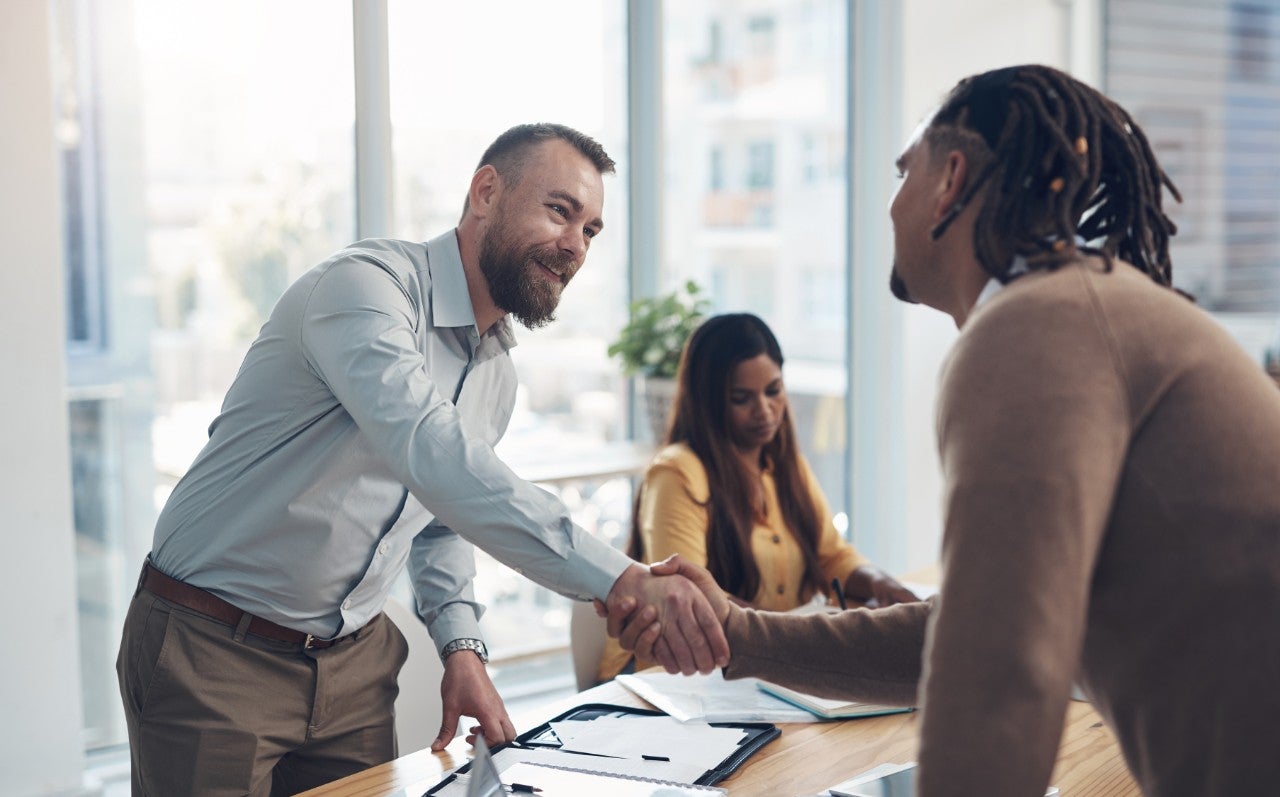 We have a deal. Cropped shot of two handsome businessmen shaking