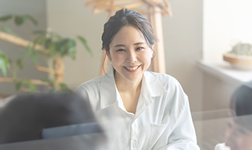 woman looking at inclusivity audit with coffee