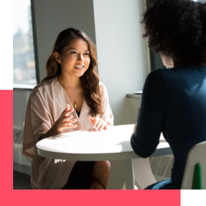 woman looking at inclusivity audit with coffee